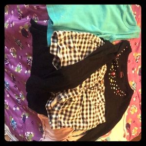 Three girls shirts and one pair of pants. Size 12.